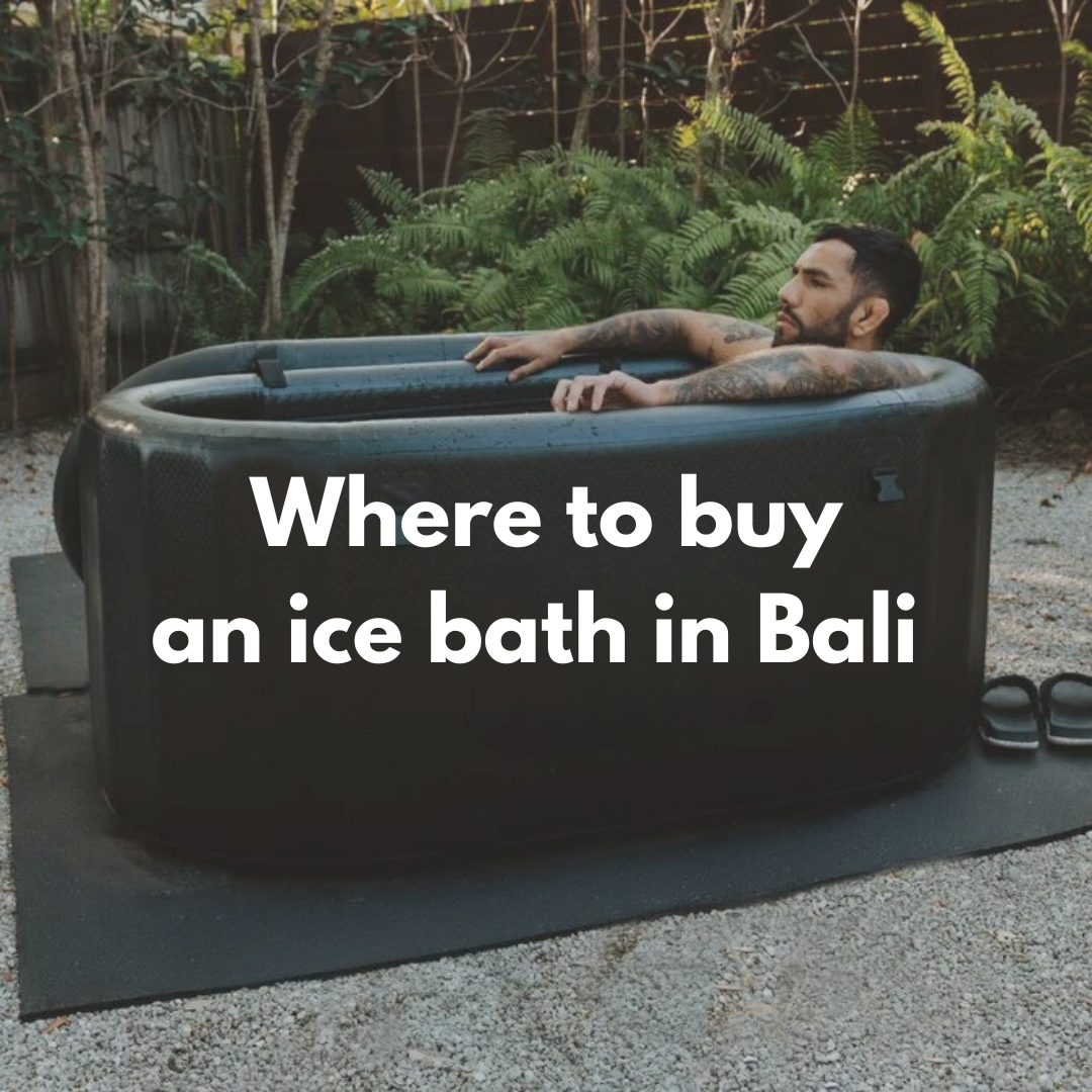 Man sitting in a black ice bath outdoors.