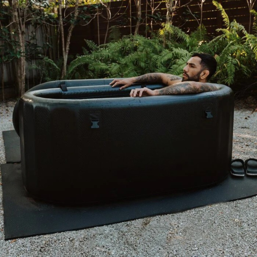 Man sitting in an ice bath