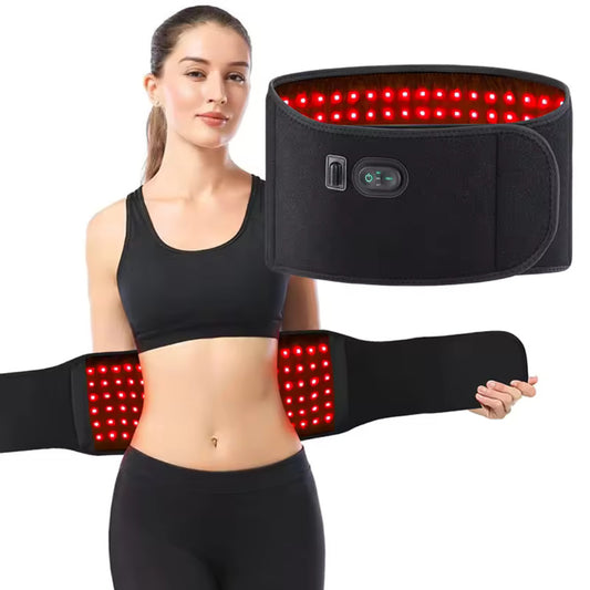 A woman with a red light therapy belt wrapped around her waist